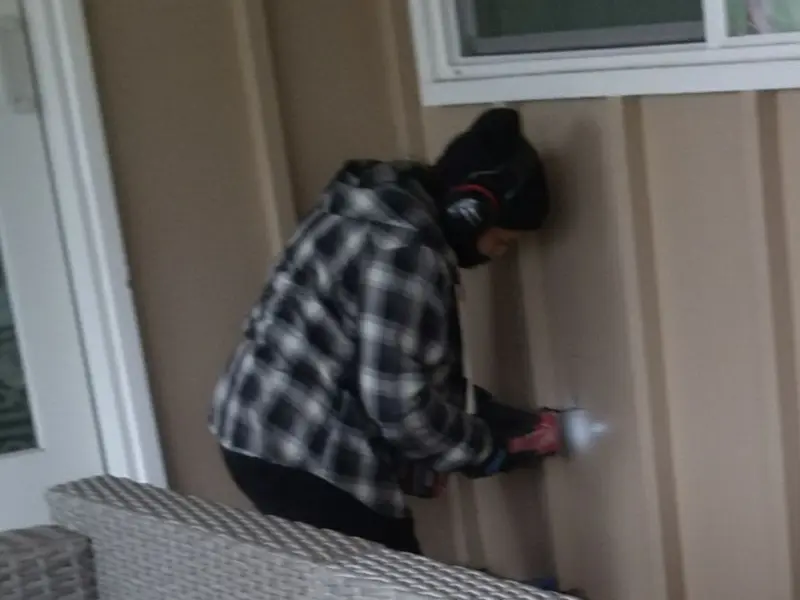 Professional electrician installing an exterior outlet in Jacksonville