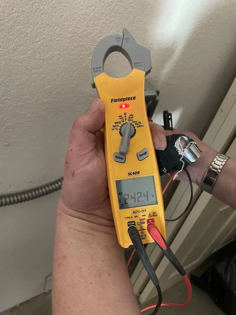 Voltage testing with clamp meter during Ceiling Fan Installation in Jacksonville